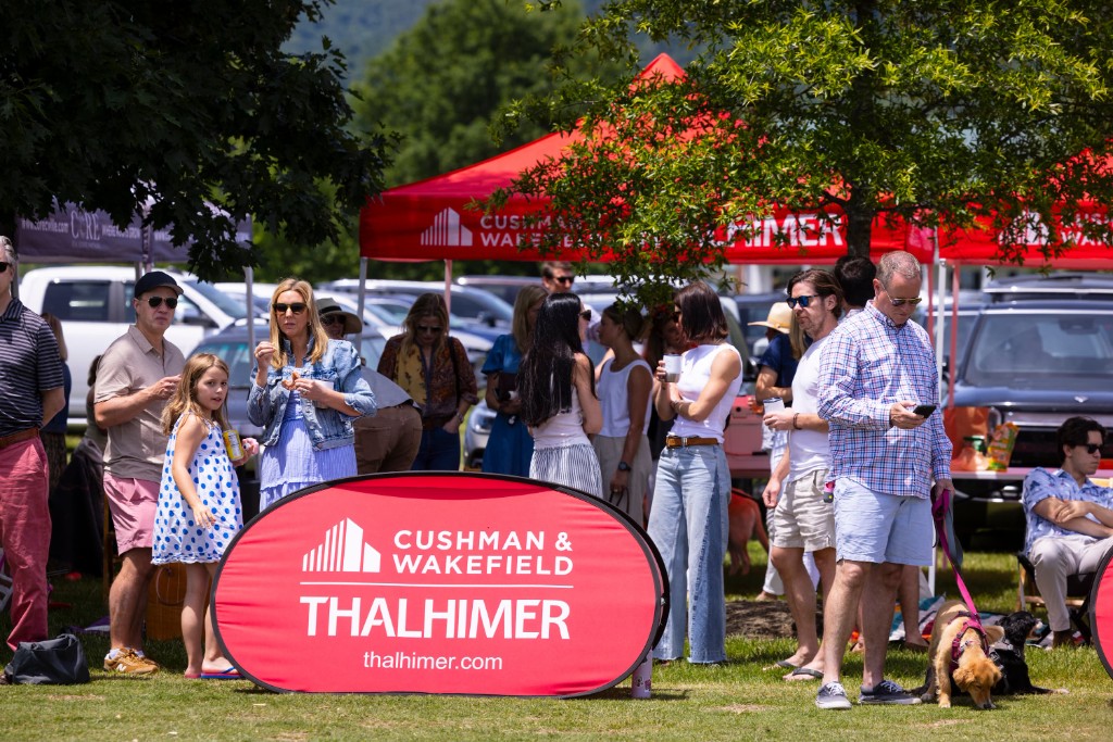 Guests socializing at the VIP sponsor tent during Sunday polo